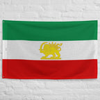 Persian-inspired flag banner with Lion & Sun emblem, symbolizing heritage and freedom on textured wall.