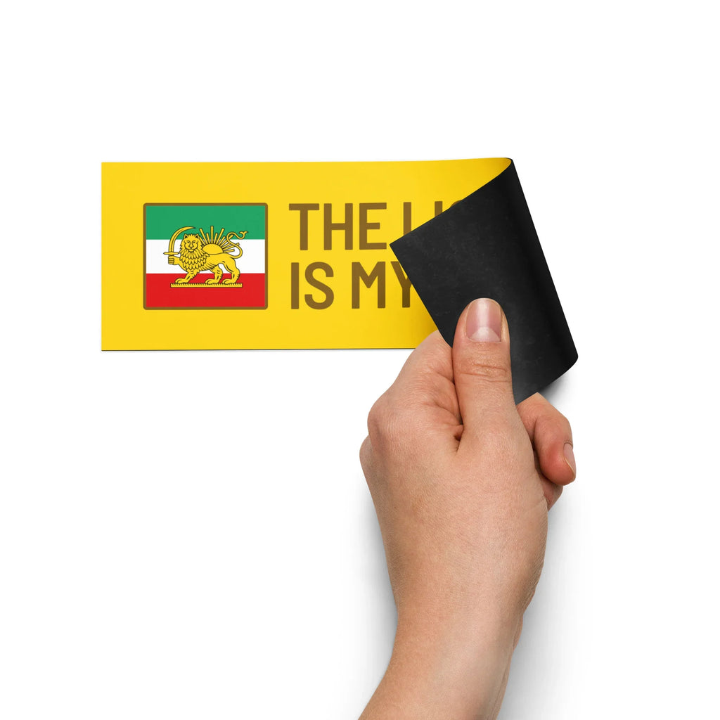 Hand peeling yellow sticker with Lion and Sun flag design and text 'THE LION IS MY'
