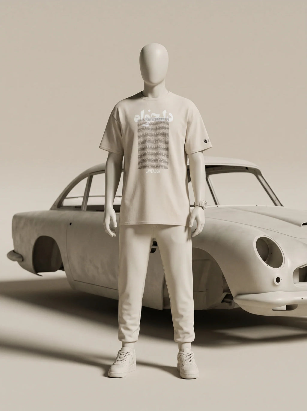 White streetwear outfit with Persian-inspired design, paired with classic car backdrop