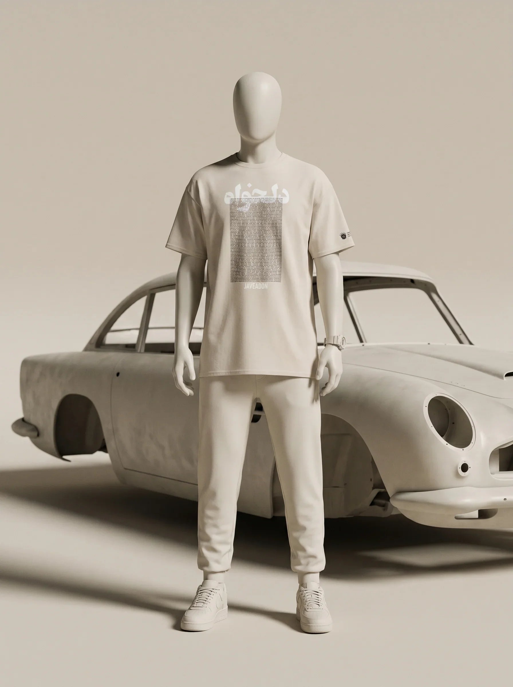 White streetwear outfit with Persian-inspired design, paired with classic car backdrop