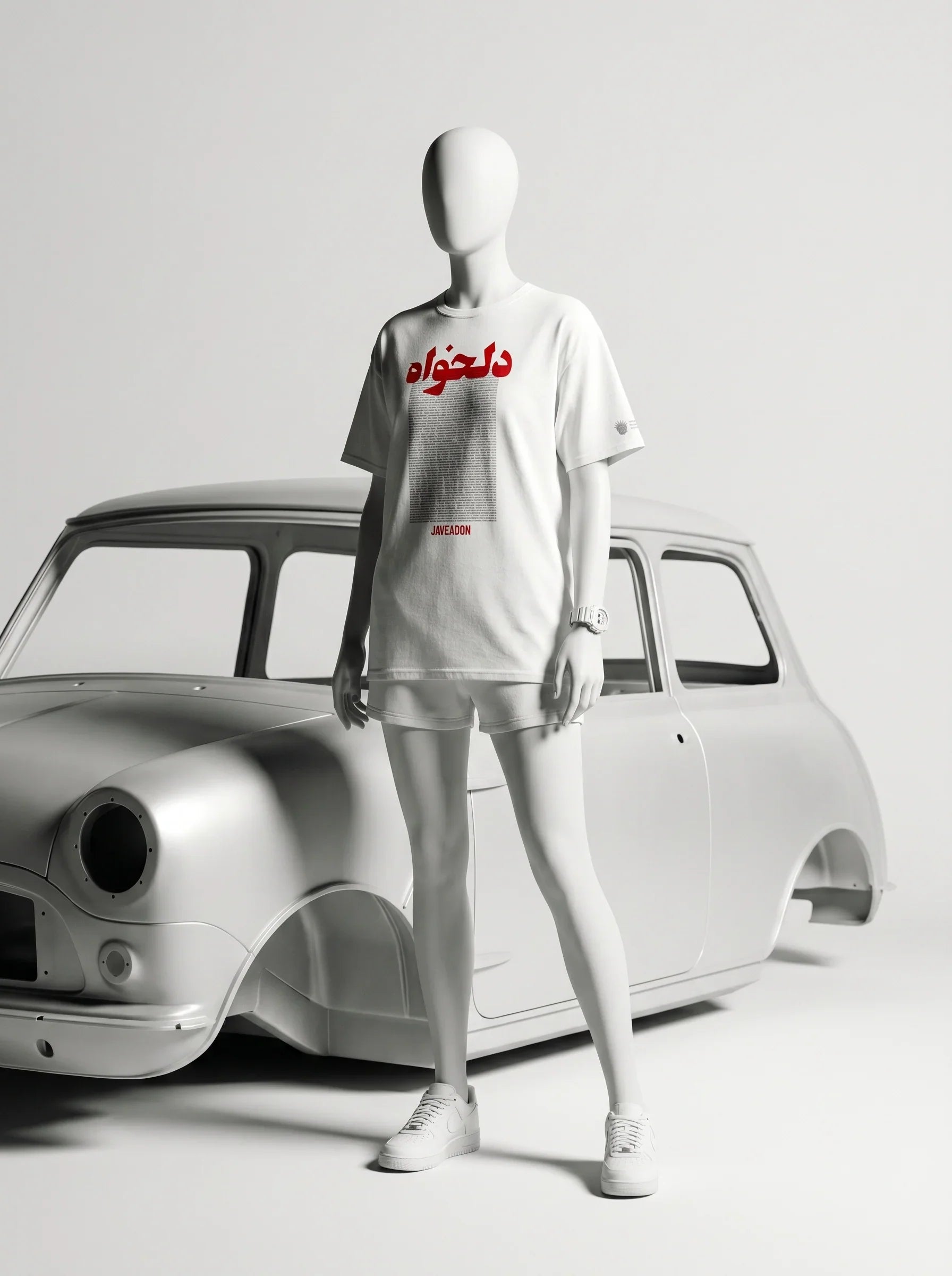 White t-shirt with Persian text and 'Javeadon' branding, styled with shorts and sneakers beside a classic car.