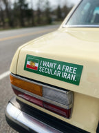 Green bumper sticker with Lion & Sun flag and text 'I WANT A FREE SECULAR IRAN' on vintage car