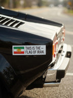 Car rear with Iran flag sticker featuring Lion and Sun, symbolizing Persian heritage and identity.