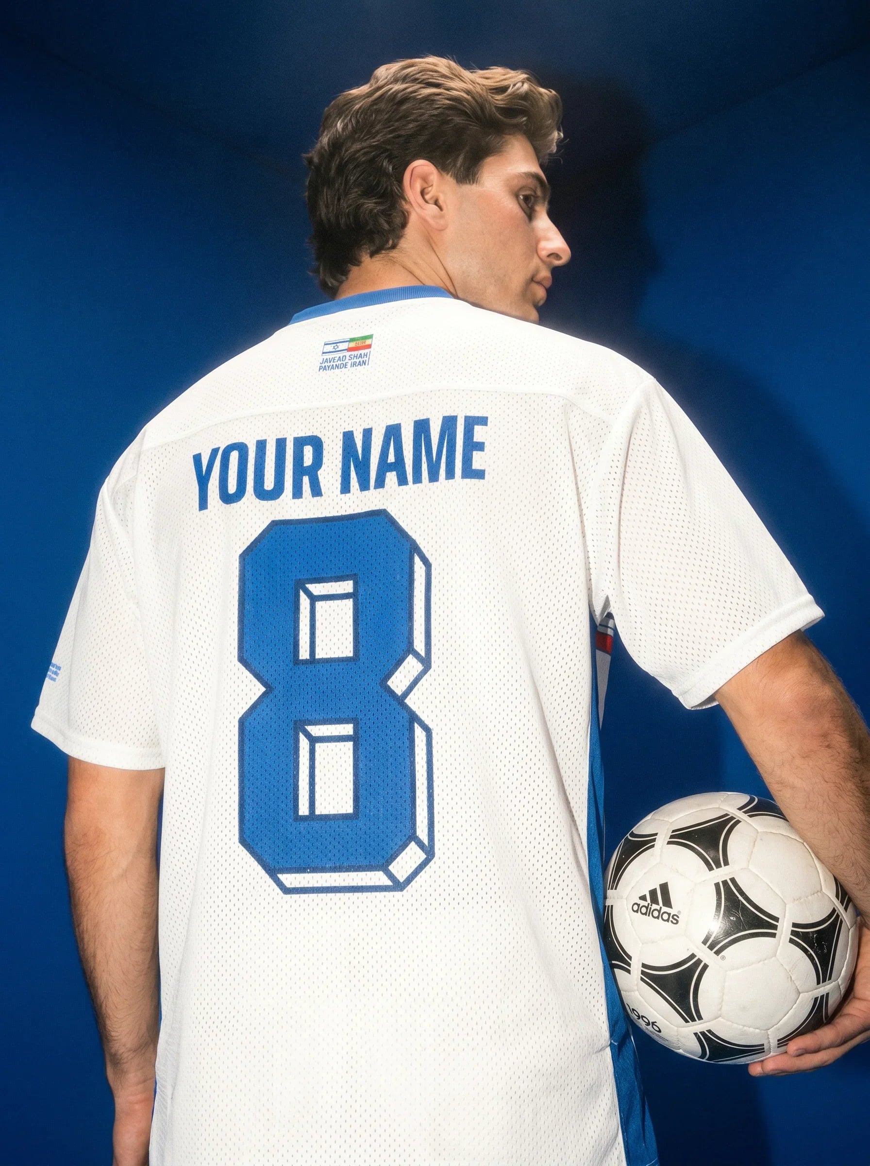 White soccer jersey with blue number 8 and 'YOUR NAME', held with Adidas ball, Persian heritage design