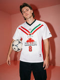 Man holding soccer ball wearing white jersey with 'Iranians for Canada' and red maple leaf design