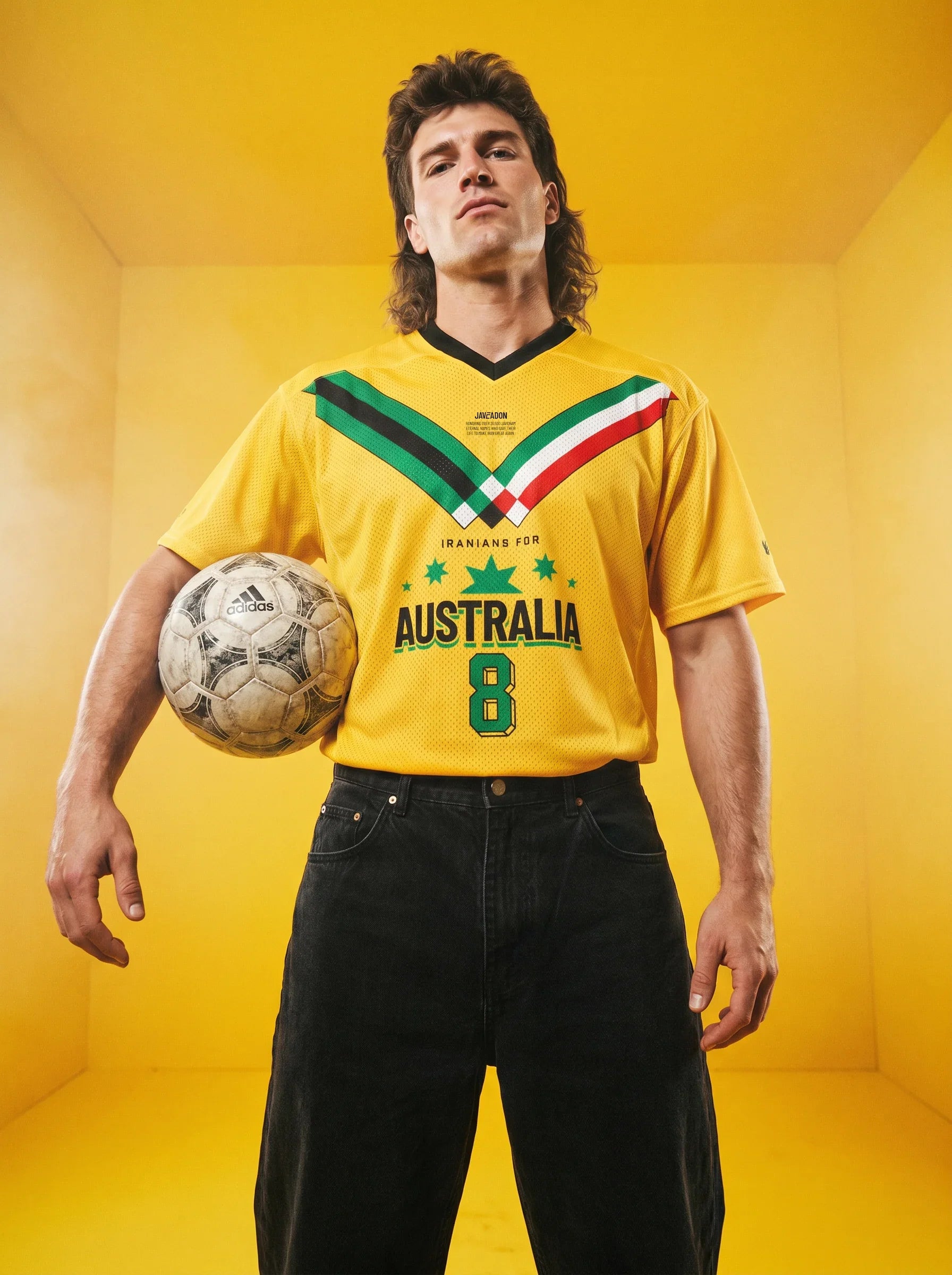Man in yellow 'Iranians for Australia' soccer jersey holding Adidas ball, vintage streetwear style